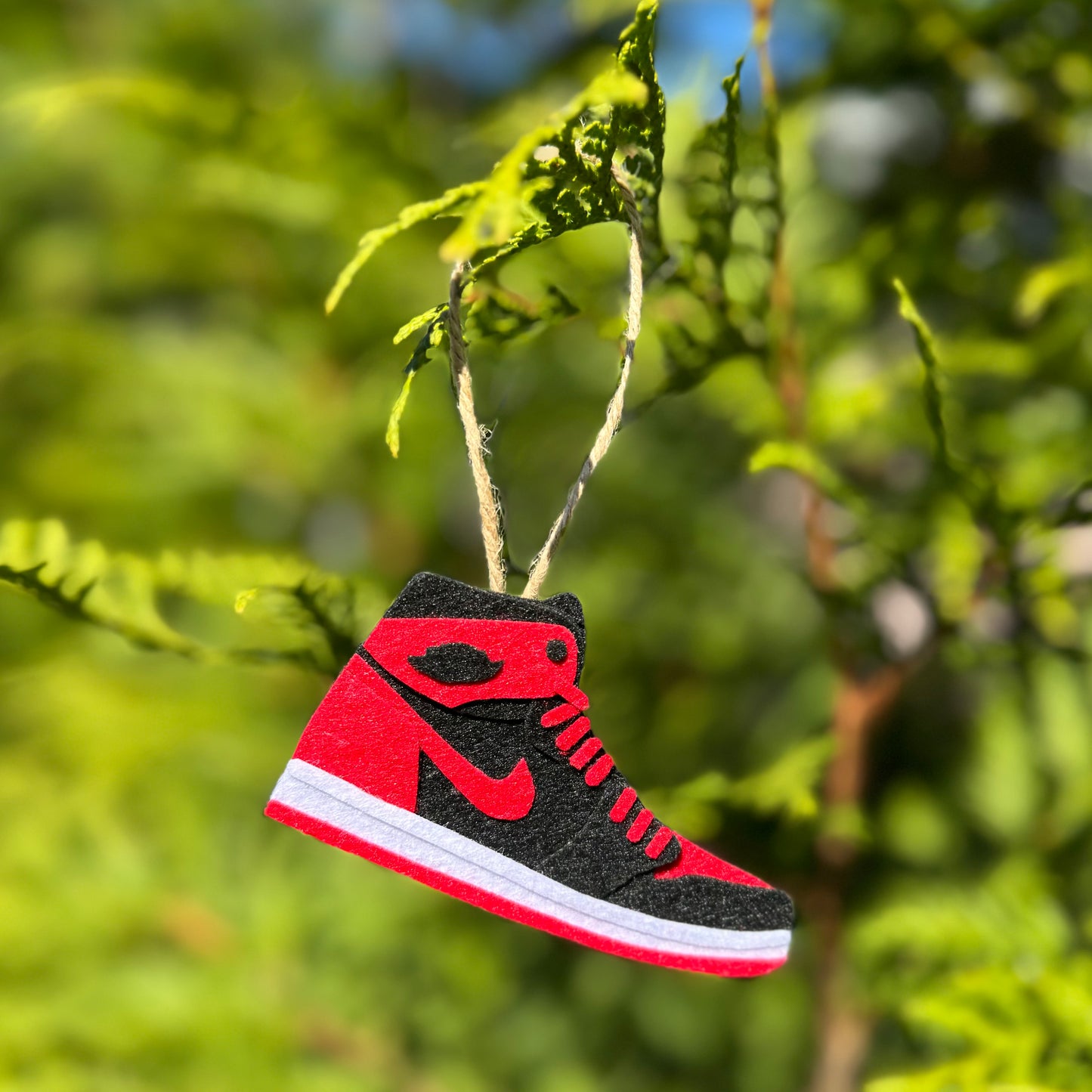 Handmade felt sneaker ornament in black and red high-top colorway