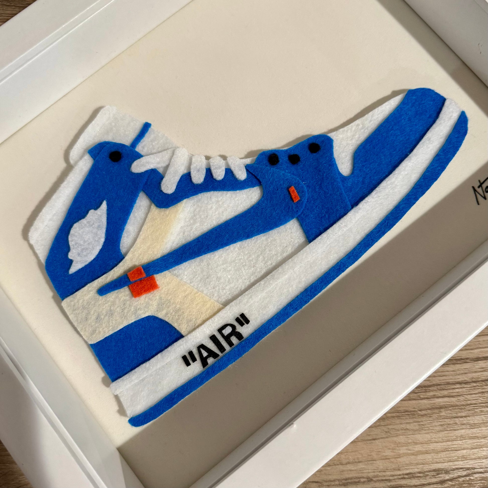Handmade felt sneaker art in blue high-top remix colorway, framed