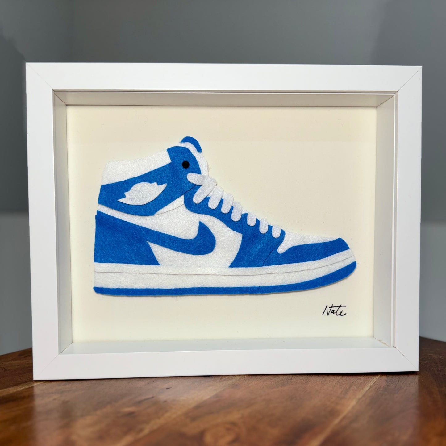 Handmade felt sneaker art in classic blue high-top colorway, framed
