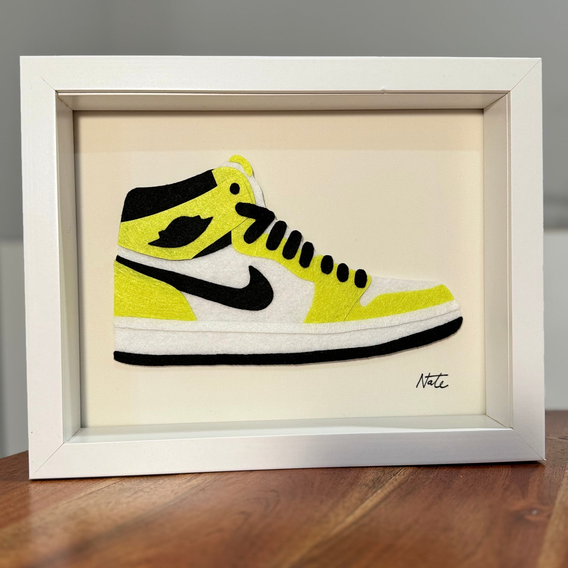 Handmade felt sneaker art in neon high-top colorway, framed