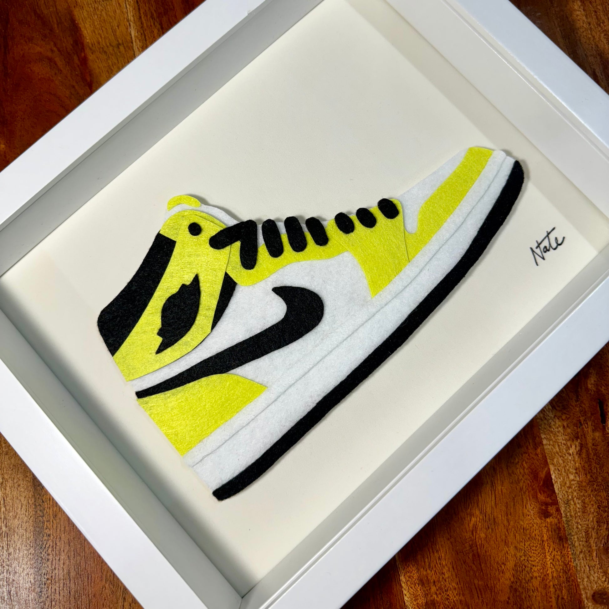 Handmade felt sneaker art in neon high-top colorway, framed