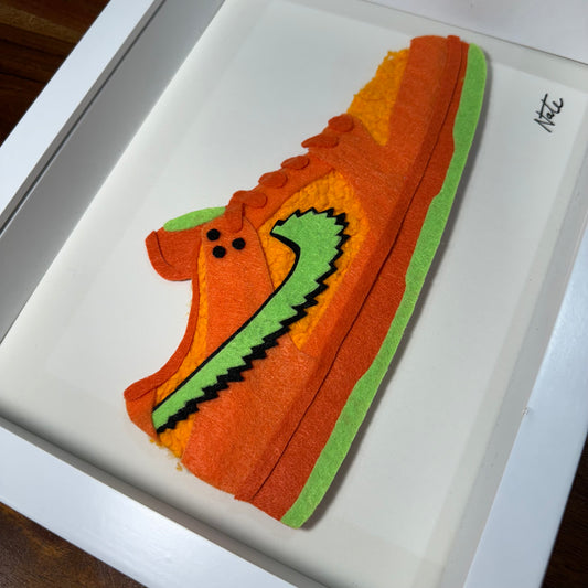 Handmade felt sneaker art with orange bear faux fur accents, framed