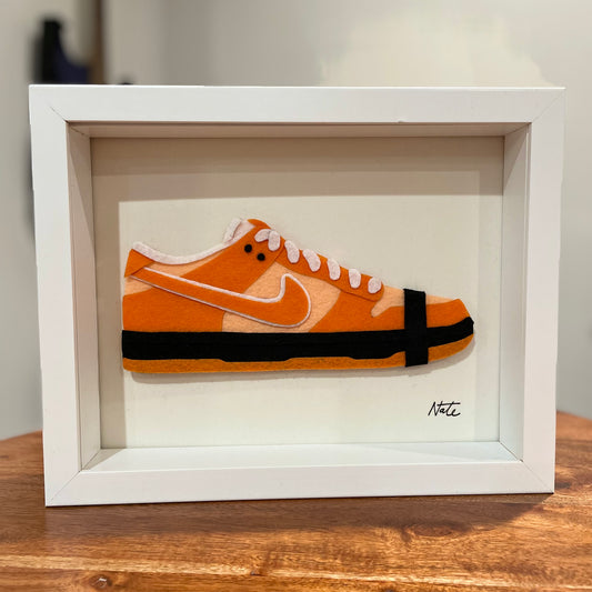 Handmade felt sneaker art in orange lobster low-top colorway, framed
