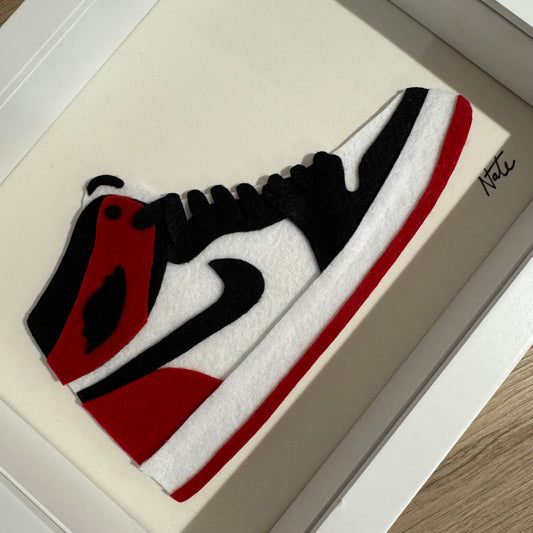 Handmade felt sneaker art in red and black high-top colorway, framed