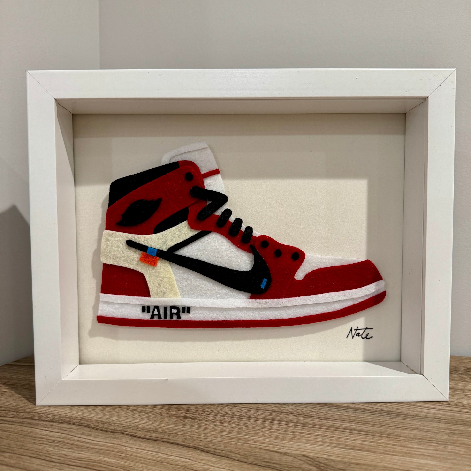 Handmade felt sneaker art in red high-top remix colorway, framed