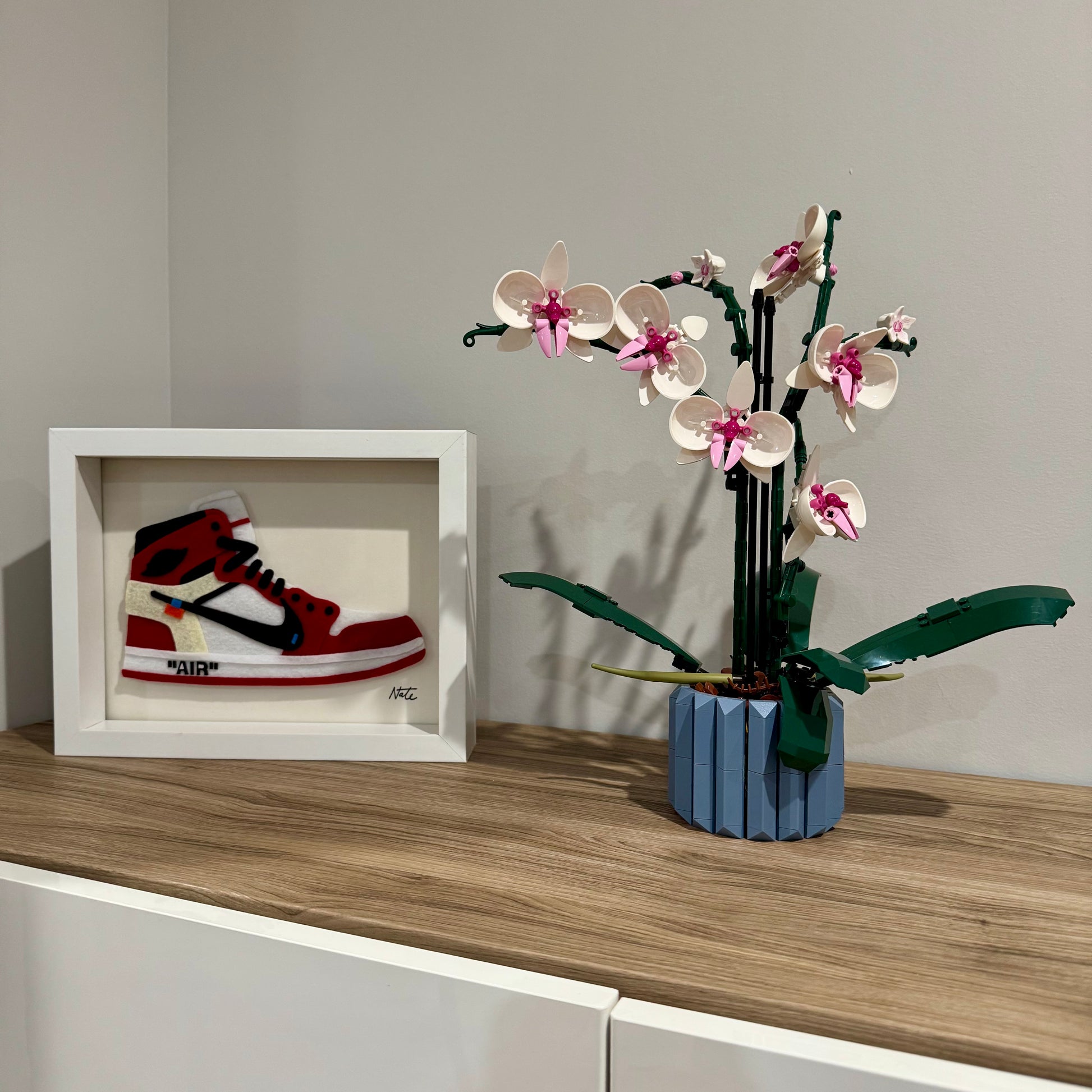 Handmade felt sneaker art in red high-top remix colorway, framed