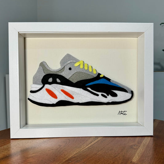Handmade felt sneaker art with wavy multicolor design, framed