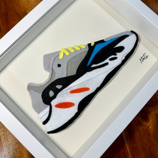 Handmade felt sneaker art with wavy multicolor design, framed