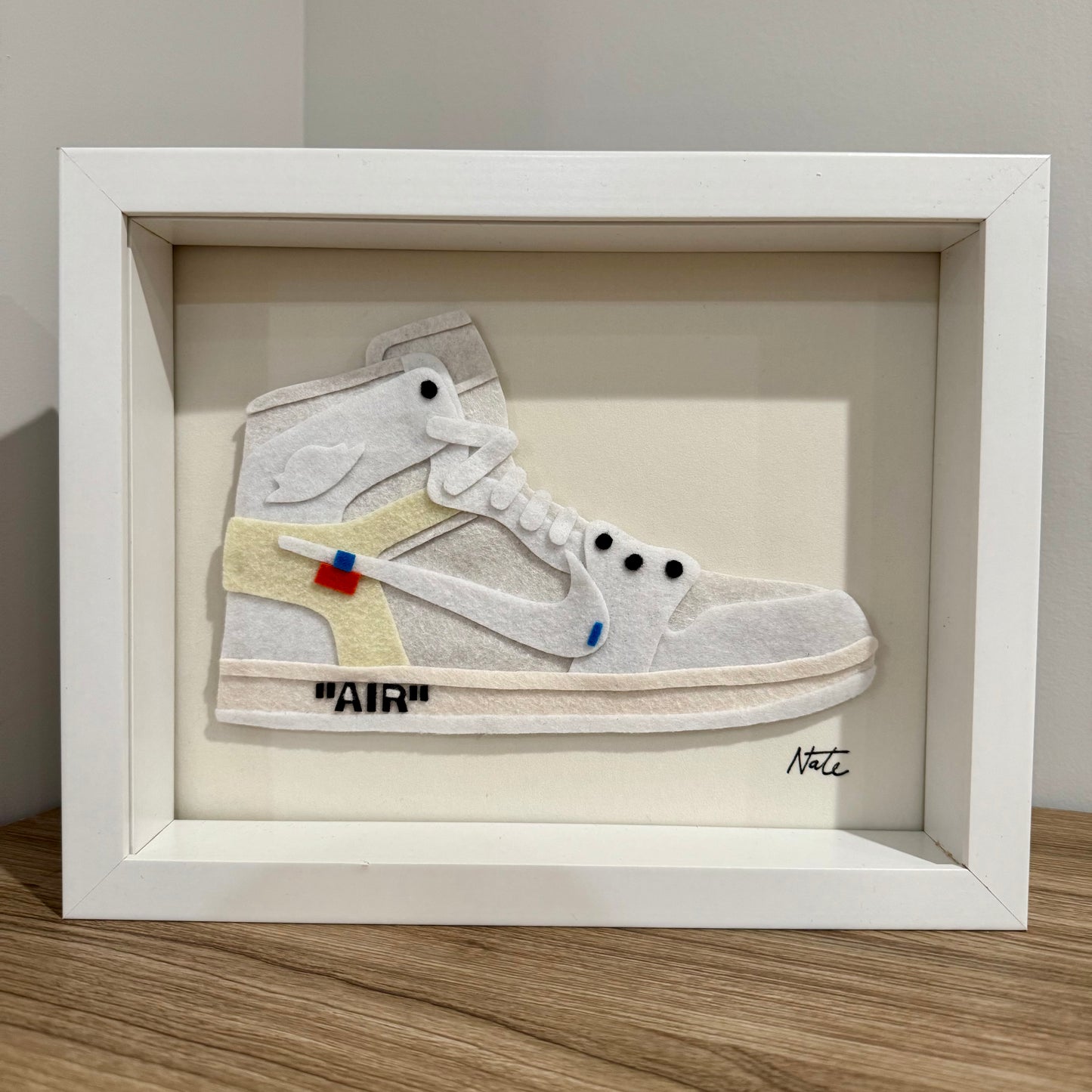 Handmade felt sneaker art in white high-top remix colorway, framed