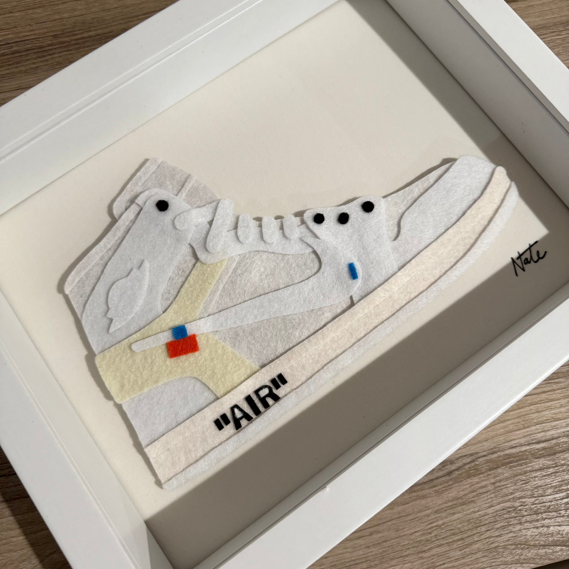 Handmade felt sneaker art in white high-top remix colorway, framed