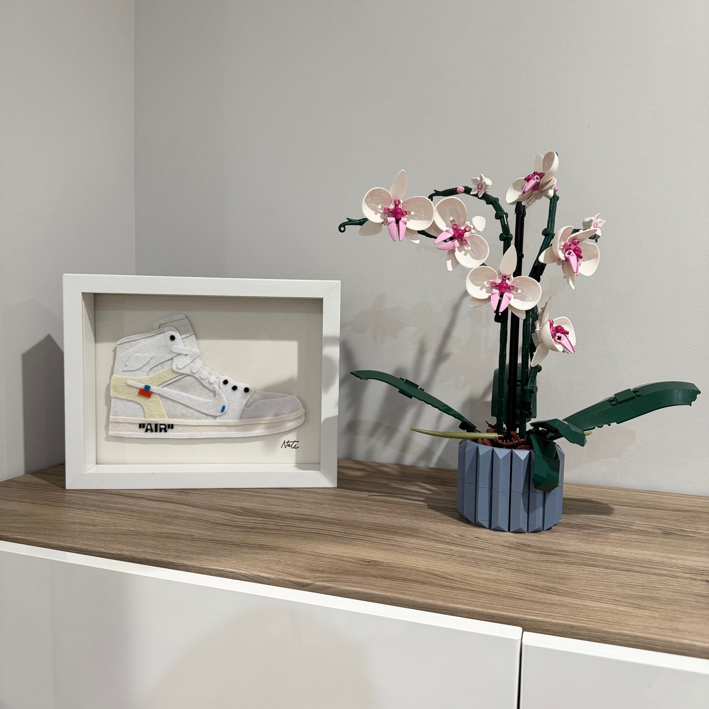 Handmade felt sneaker art in white high-top remix colorway, framed